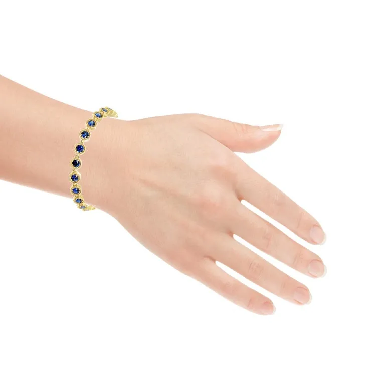 Blue Sapphire and 18k Yellow Gold Tennis Bracelet, 4.96 Carats Total, 7 Inches