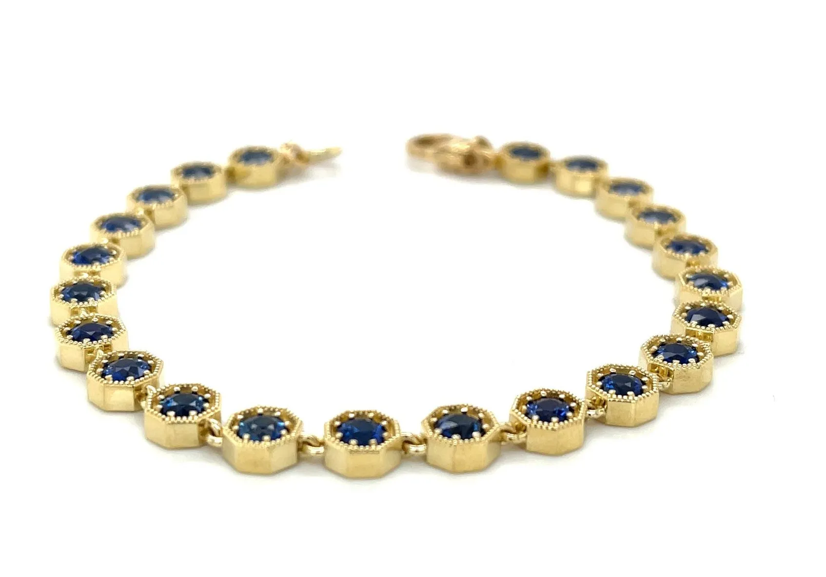 Blue Sapphire and 18k Yellow Gold Tennis Bracelet, 4.96 Carats Total, 7 Inches
