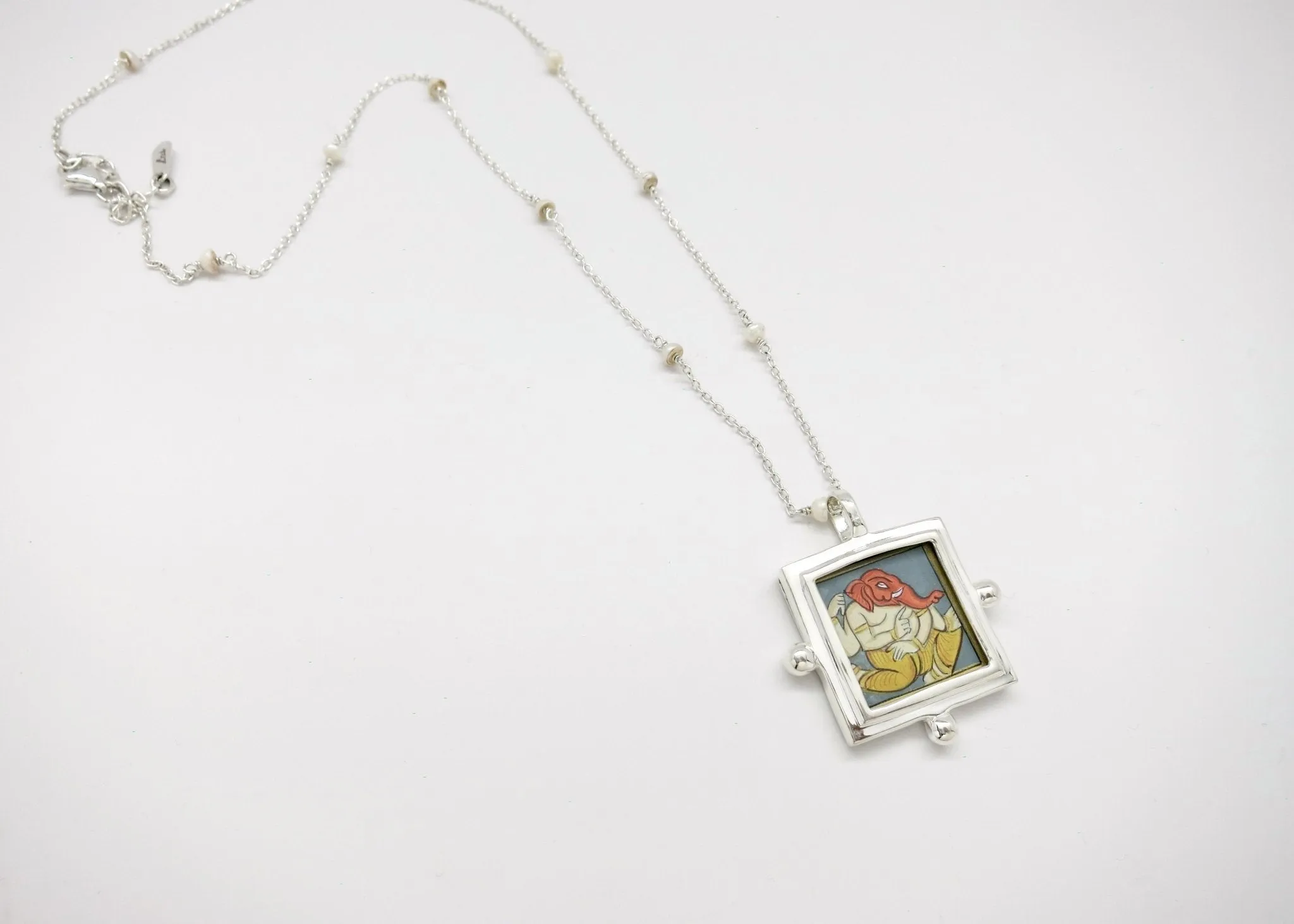 Ganesha miniature painting pendant on a floating pearl chain