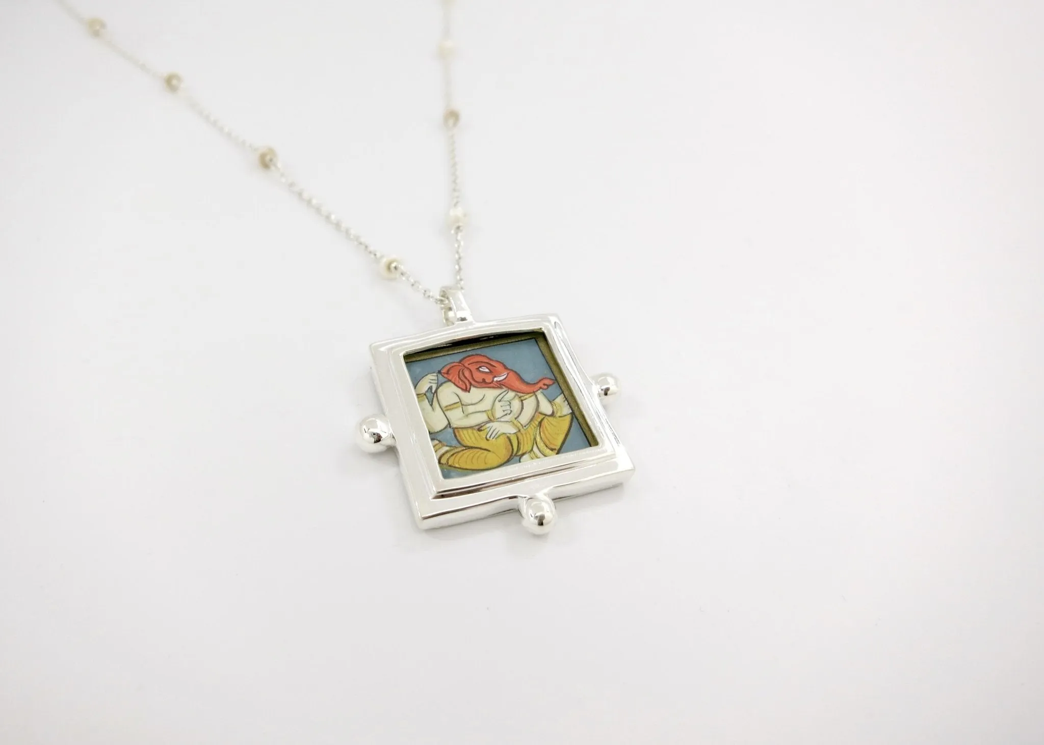 Ganesha miniature painting pendant on a floating pearl chain